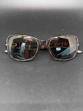 Women’s Persol sunglasses with amber lenses and tortoises frames